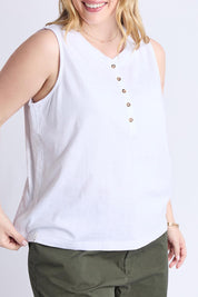 A model wearing the Fundamental Elysian Cotton Tank in colour White (White), from the front, cropped image