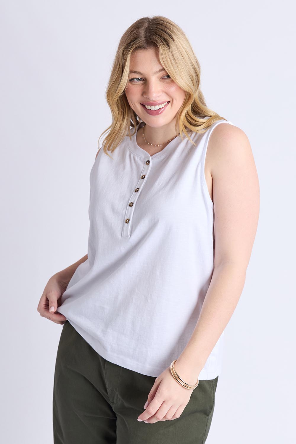 A model wearing the Fundamental Elysian Cotton Tank in colour White (White), from the front, cropped image