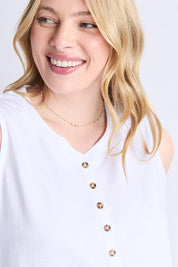 A model wearing the Fundamental Elysian Cotton Tank in colour White (White), from the front, cropped image
