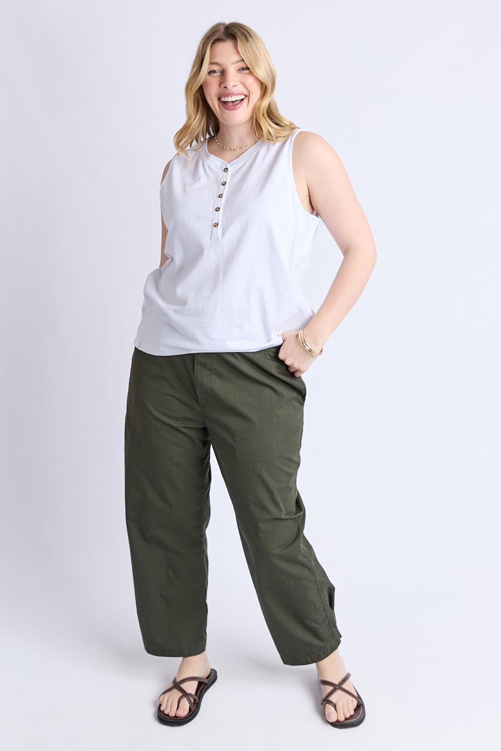 A model wearing the Fundamental Elysian Cotton Tank in colour White (White), from the front, showing the whole outfit