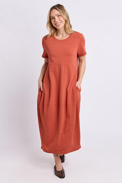 Model Genericm wearing size sample of the Fundamental Diana Cotton Tee Dress - Earth in colour Earth, from the front