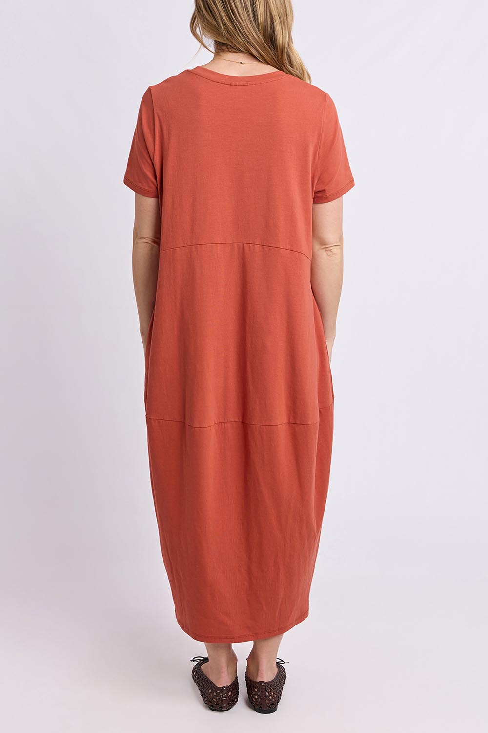 Model Genericm wearing size sample of the Fundamental Diana Cotton Tee Dress - Earth in colour Earth, from the front