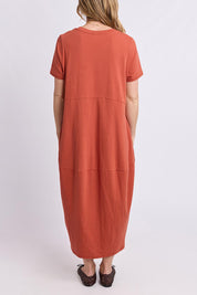 Model Genericm wearing size sample of the Fundamental Diana Cotton Tee Dress - Earth in colour Earth, from the front