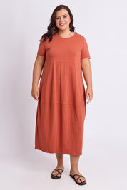 Model Genericm wearing size sample of the Fundamental Diana Cotton Tee Dress - Earth in colour Earth, from the front