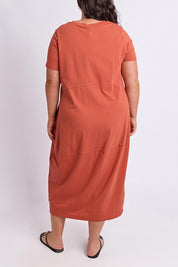 Model Genericm wearing size sample of the Fundamental Diana Cotton Tee Dress - Earth in colour Earth, from the front
