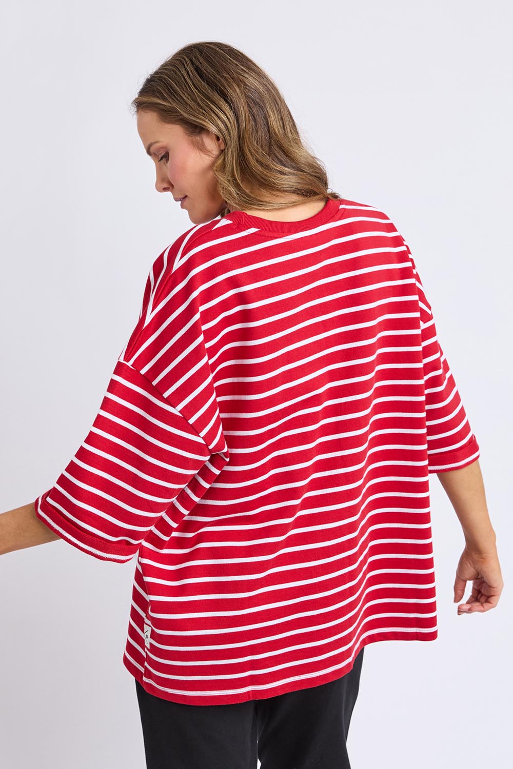 A model wearing the Fundamental Valentina Sweat in colour Cranbwhit (Red), from the back
