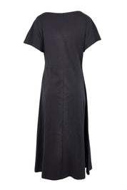 Product shot of the Fundamental Lottie Cotton Dress – Black in colour Black, from the back