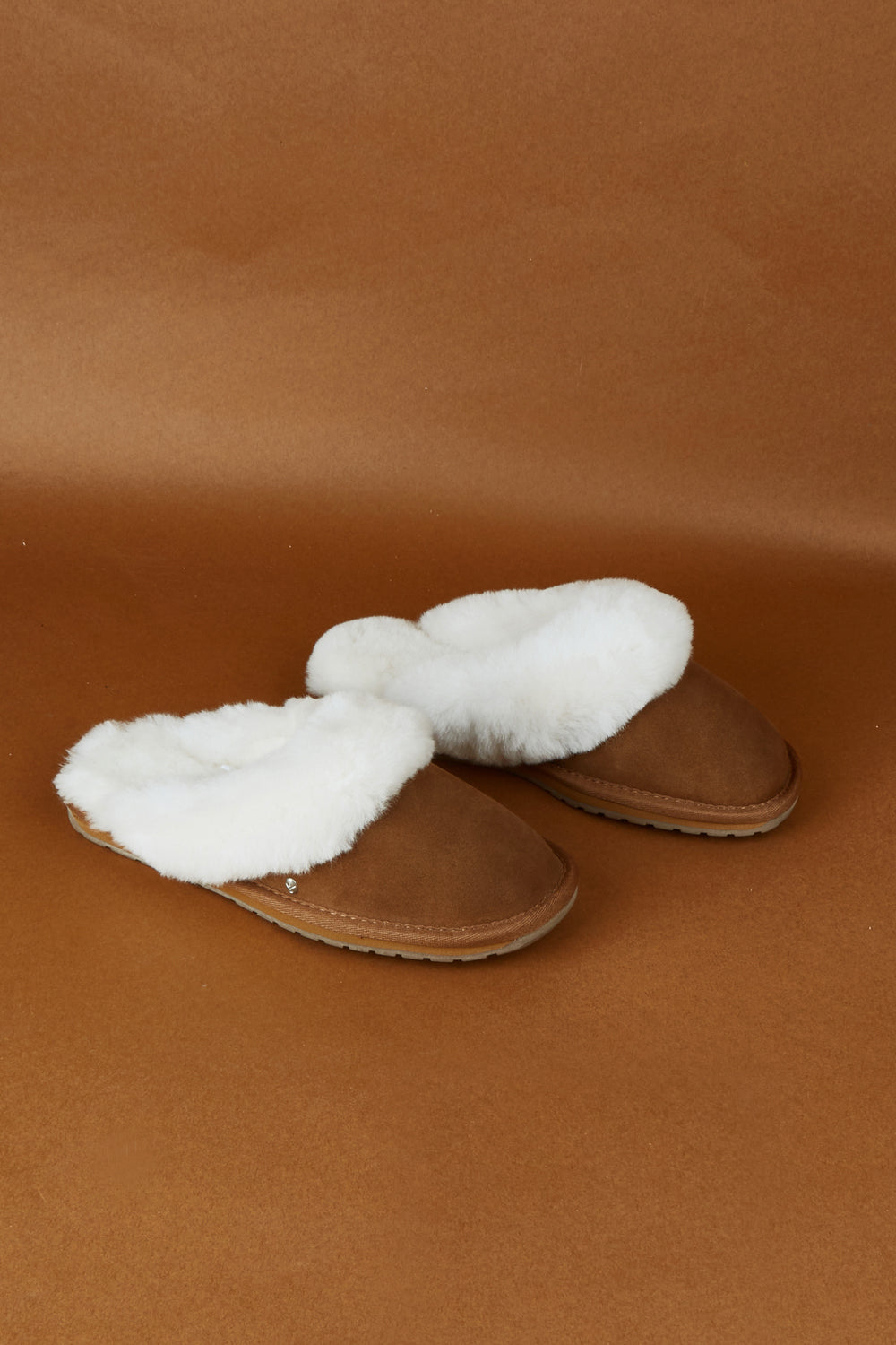 A model wearing size 7 of the Jolie Sheepskin Slipper in colour Chestnut, from the front, showing the whole outfit