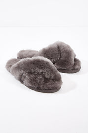 A model wearing size 7 of the Mayberry Slipper Slide in colour Charcoal (Grey), from the front, showing the whole outfit