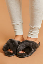 A model wearing size 8 of the Mayberry Slipper Slide in colour Charcoal (Grey), from the front, cropped image