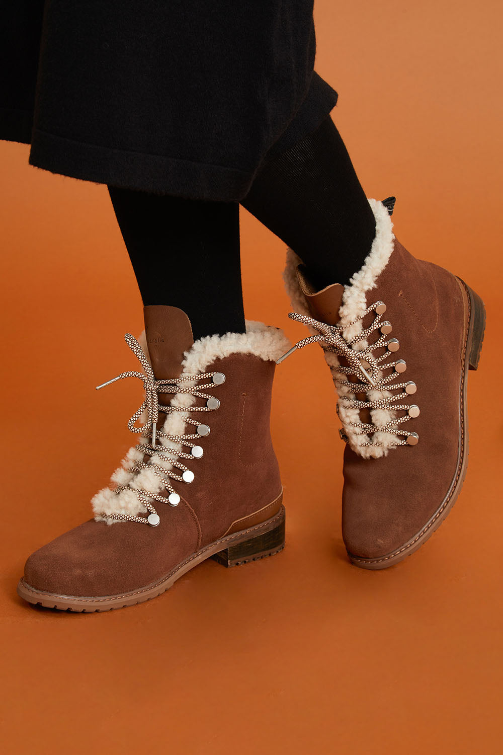 Model Sandy wearing size 9 of the Billington Waterproof Boot in colour Oak, from the front, cropped image