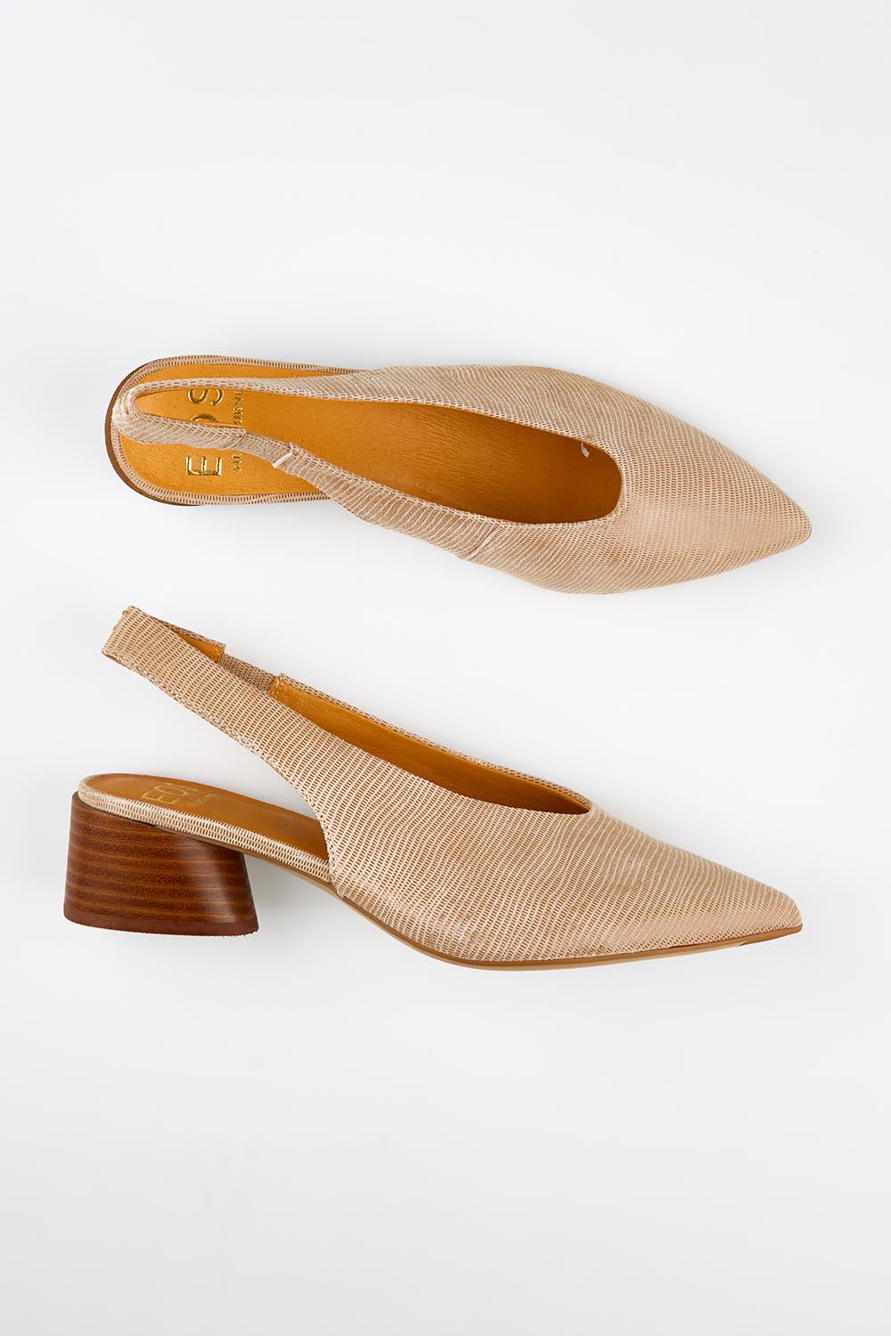 Model Genericm wearing size sample of the Hatti Heel - Sand in colour Sand, from an angle
