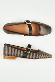 A model wearing size 37 of the Sophy Leather Flat in colour Blackgrass (Black), from the front, showing the whole outfit