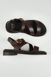 A model wearing size 37 of the Starla Leather Flat in colour Chocolate, from the front, showing the whole outfit