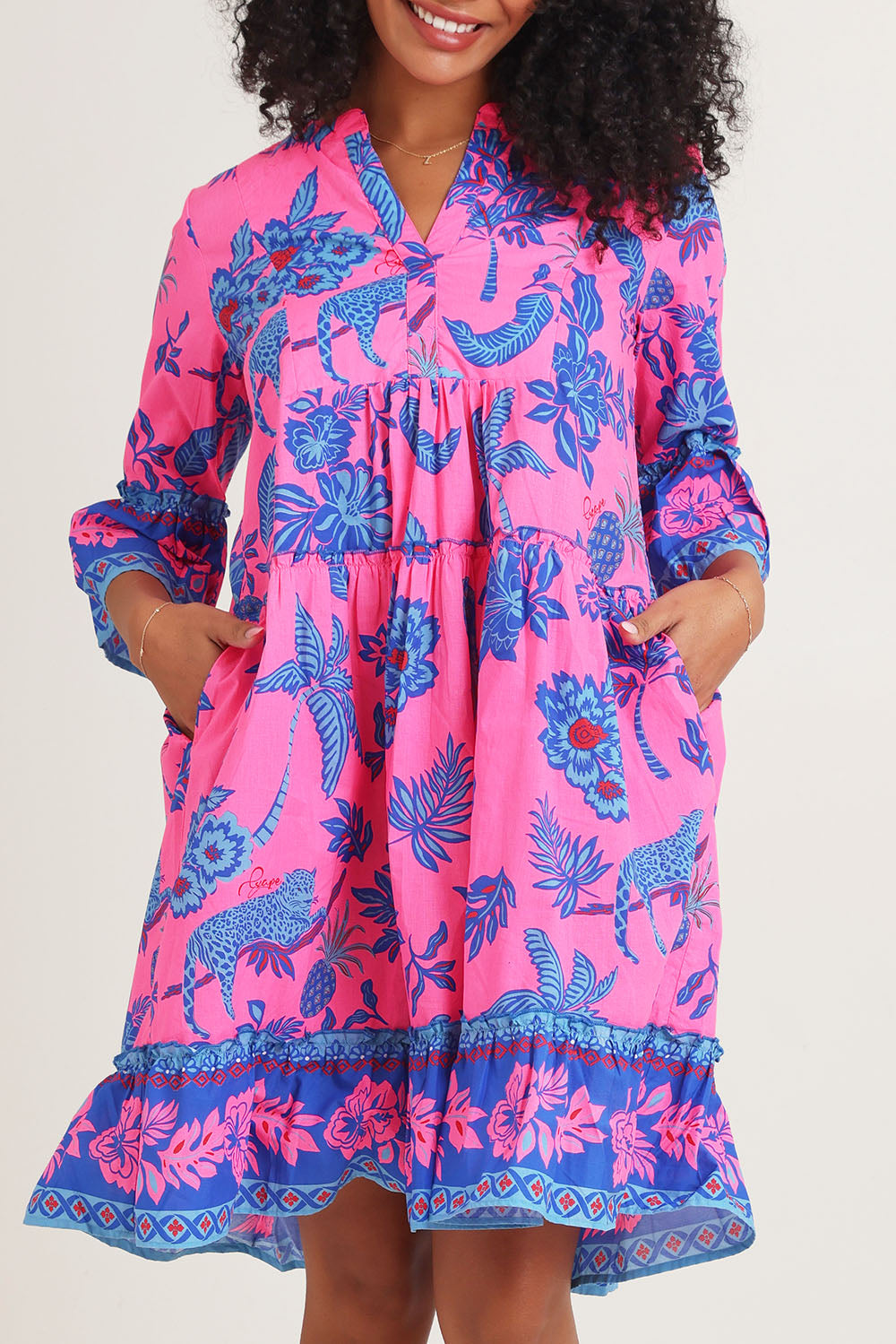Model Ziara wearing size 10 of the Lidia Cotton Frill Sleeve Layers Dress in colour Print, from the front, cropped image