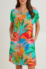 Model Madeline wearing size 10 of the Alisa Shift Short Sleeve Dress in colour Print (Green), from the front, cropped image