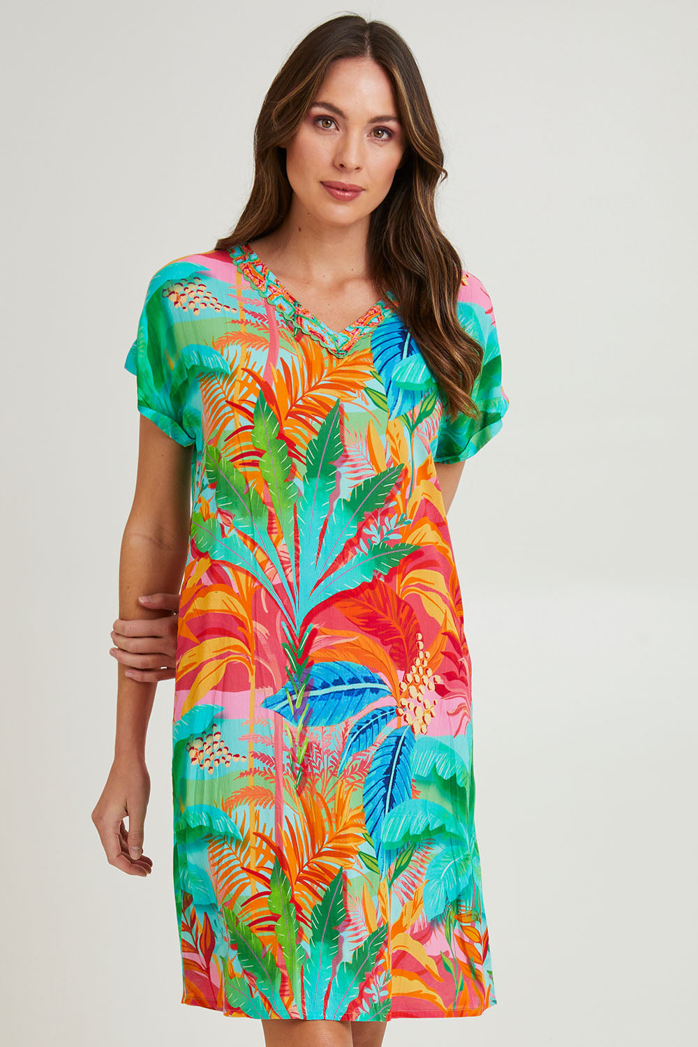 Model Madeline wearing size 10 of the Alisa Shift Short Sleeve Dress in colour Print (Green), from the front, cropped image
