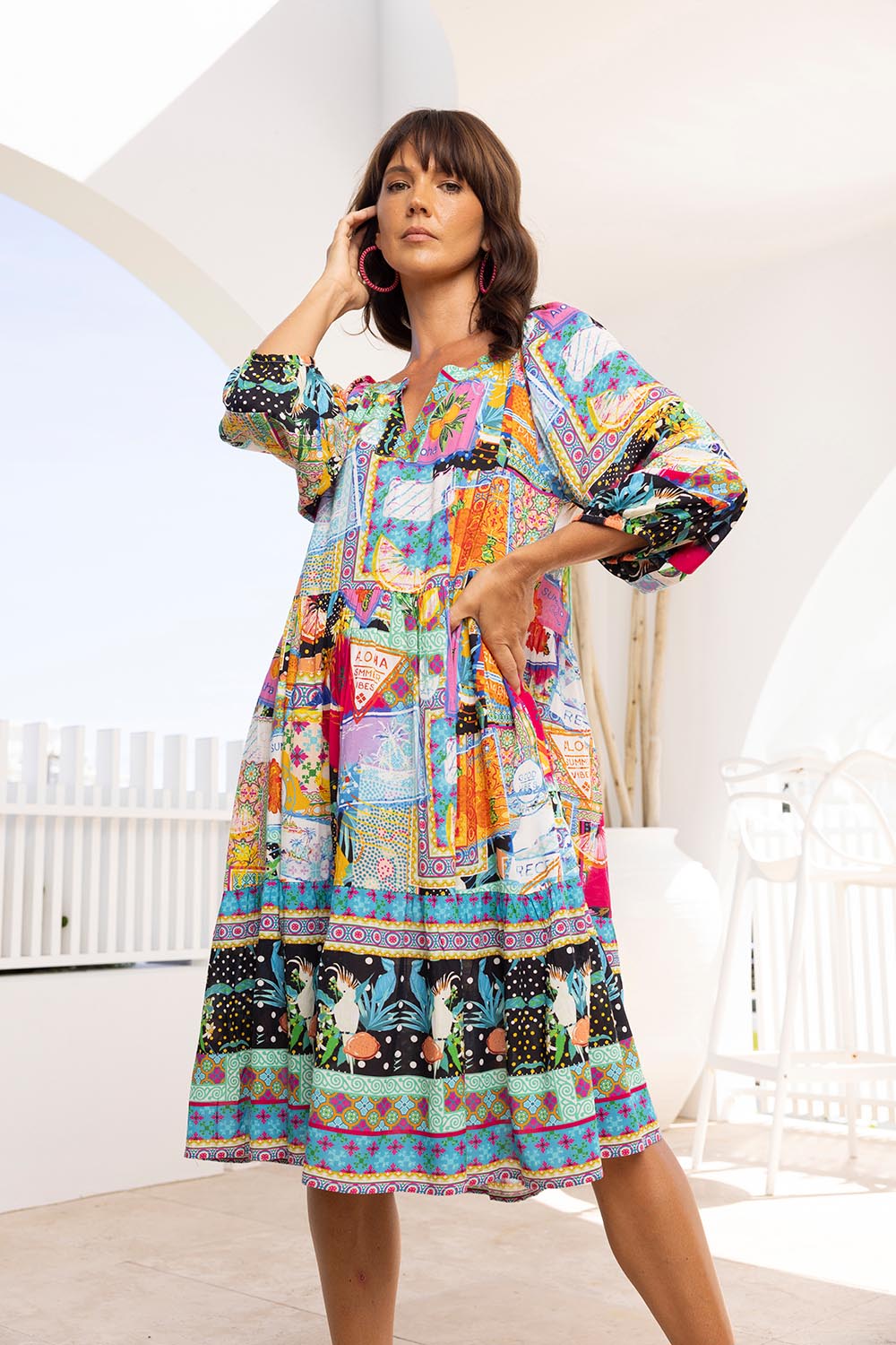A model wearing the Lana Layers 3/4 Sleeve Dress in colour Print (Blue), from the front, showing the whole outfit