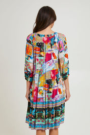 Model Madeline wearing size 10 of the Lana Layers 3/4 Sleeve Dress in colour Print (Blue), from the back