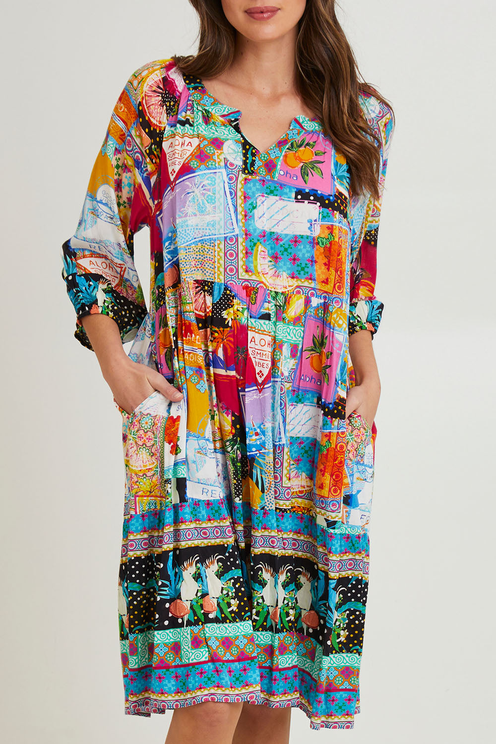 Model Madeline wearing size 10 of the Lana Layers 3/4 Sleeve Dress in colour Print (Blue), from the front, cropped image