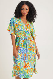 Model Ziara wearing size 10 of the Fiorella Waist Dress in colour Print, from the front, cropped image