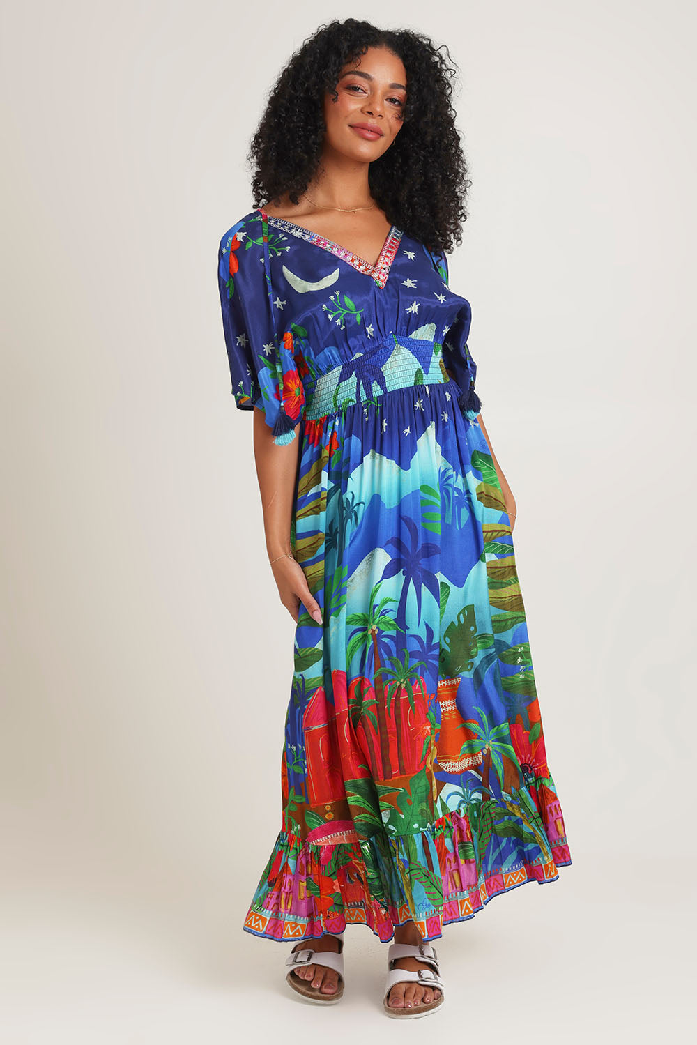 Model Ziara wearing size 10 of the Arabian Nights Shirred Waist Dress in colour Print, from the front, showing the whole outfit
