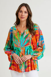 Model Madeline wearing size 10 of the Alisa Boho Top in colour Print (Green), from the front, cropped image