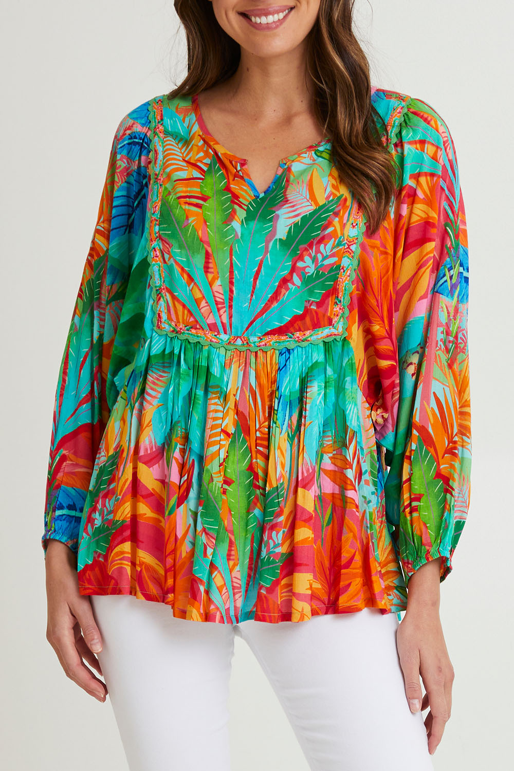 Model Madeline wearing size 10 of the Alisa Boho Top in colour Print (Green), from the front, cropped image