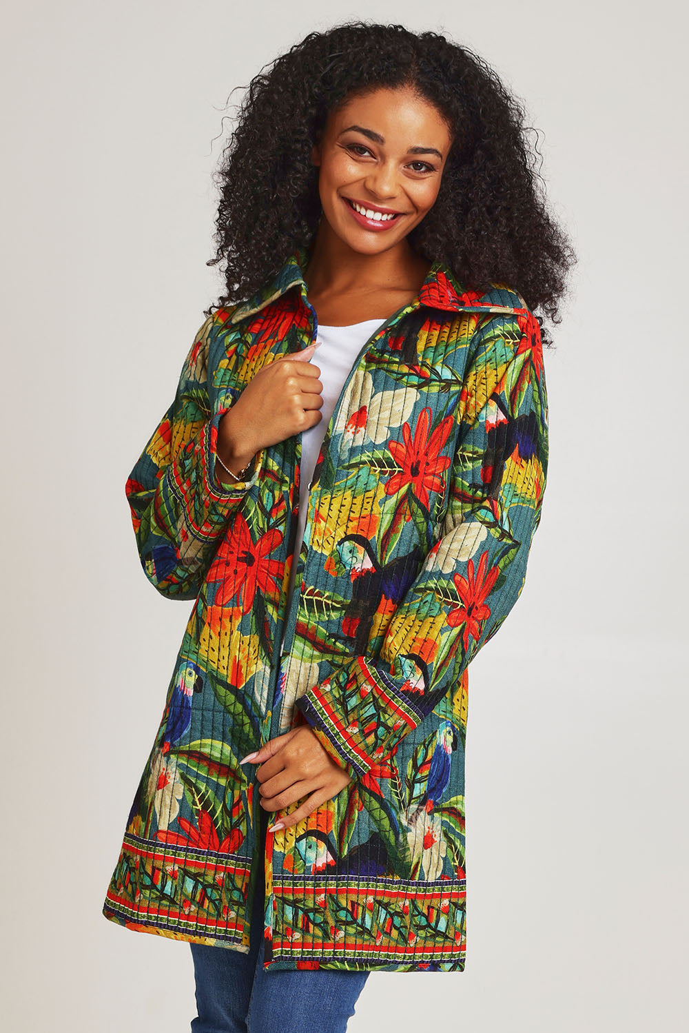 Model Ziara wearing size 10 of the Galapagos Quilted Coat in colour Galapagos, from the front, cropped image