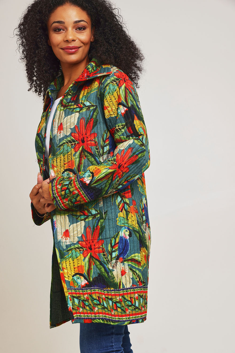 Model Ziara wearing size 10 of the Galapagos Quilted Coat in colour Galapagos, from the front, cropped image