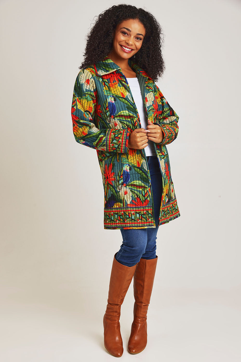 Model Ziara wearing size 10 of the Galapagos Quilted Coat in colour Galapagos, from the front, showing the whole outfit