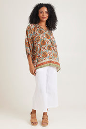 Model Ziara wearing size 10 of the Vera Top in colour Print, from the front, showing the whole outfit