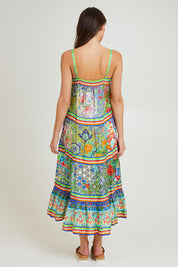 Model Madeline wearing size 10 of the Tara Maxi Strappy Dress in colour Print (Green), from the back