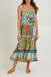 Model Madeline wearing size 10 of the Tara Maxi Strappy Dress in colour Print (Green), from the front, cropped image