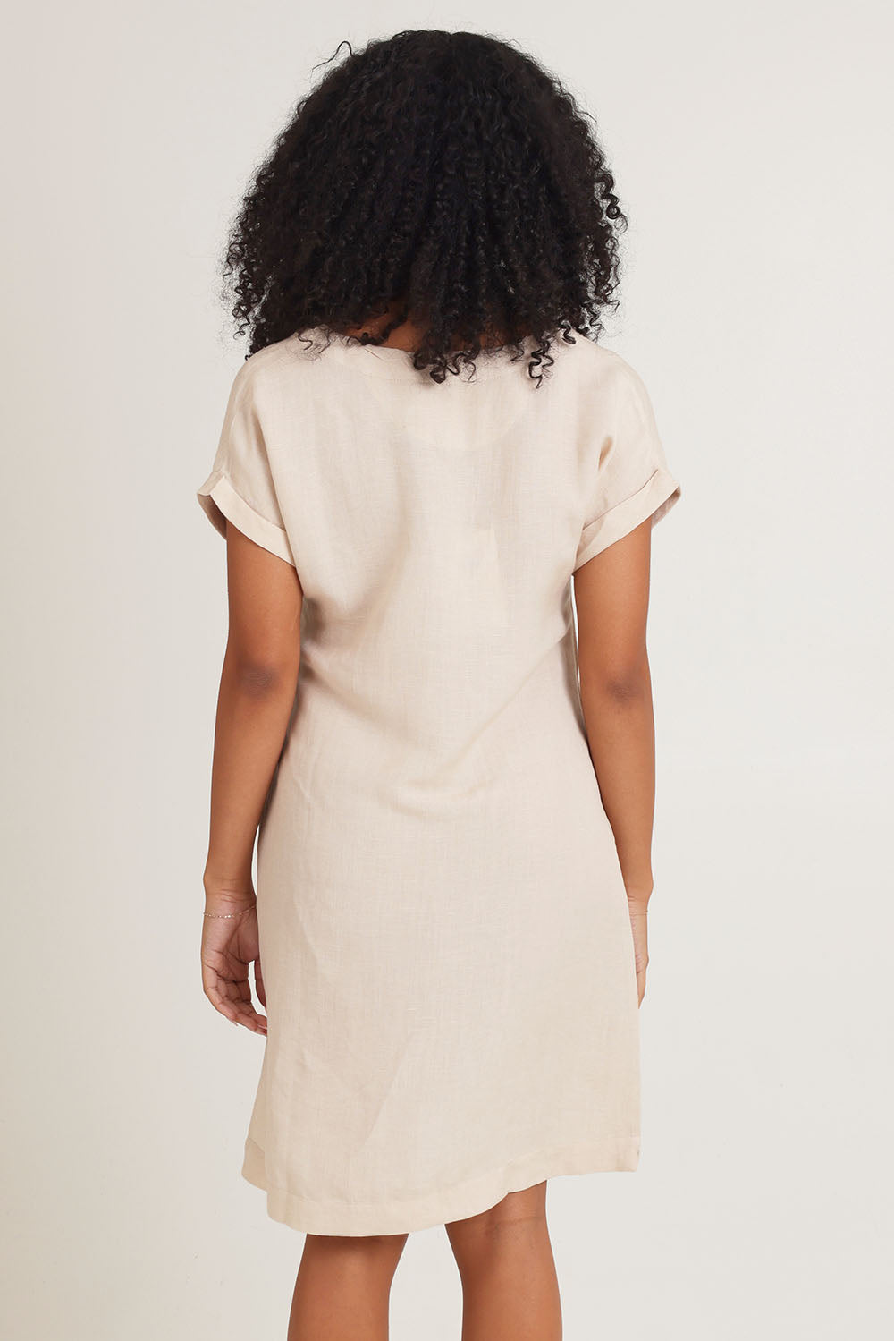 Model Ziara wearing size 10 of the Linen Blend Solid Shift Dress in colour Sand, from the back