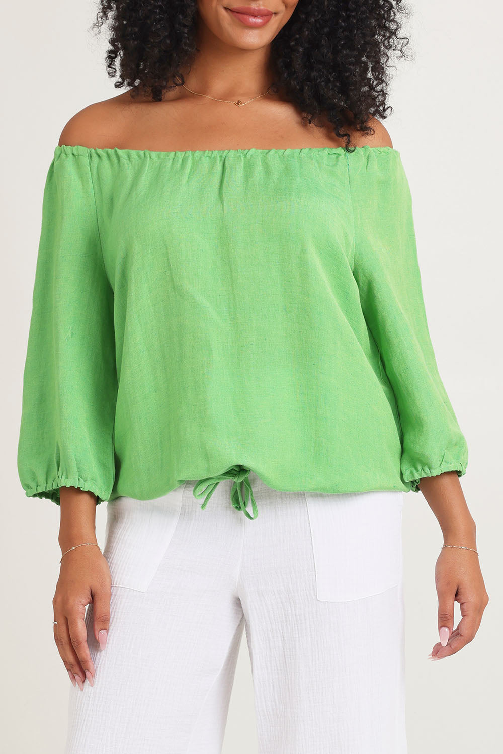 Model Ziara wearing size 10 of the Gather Neck 3/4 Sleeve Linen Blend Top in colour Green (Green), from the front, cropped image