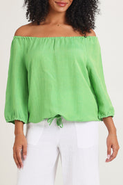 Model Ziara wearing size 10 of the Gather Neck 3/4 Sleeve Linen Blend Top in colour Green (Green), from the front, cropped image