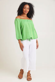Model Ziara wearing size 10 of the Gather Neck 3/4 Sleeve Linen Blend Top in colour Green (Green), from the front, showing the whole outfit