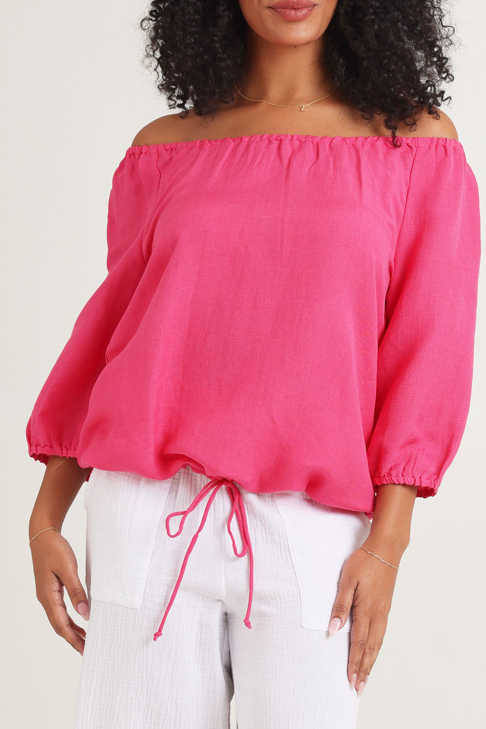 Model Ziara wearing size 10 of the Gather Neck 3/4 Sleeve Linen Blend Top in colour Hotpink (Blue), from the front, cropped image