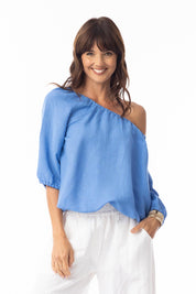 A model wearing the Gather Neck 3/4 Sleeve Linen Blend Top in colour Ibizablue (Blue), from the front, cropped image