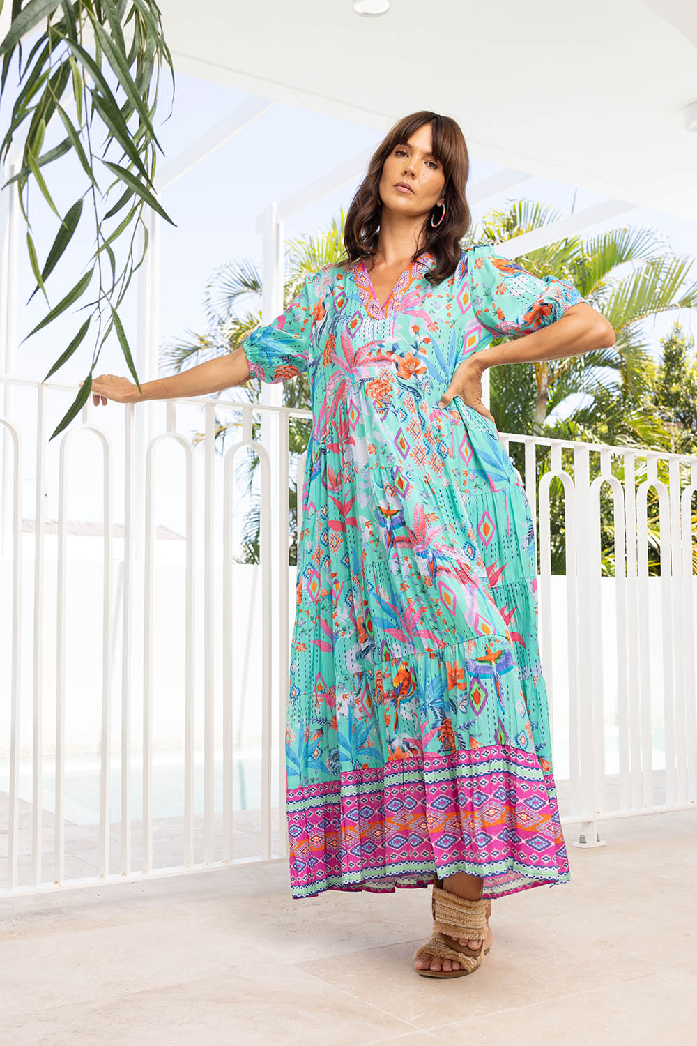 A model wearing the Marina Maxi Dress in colour Print (Blue), from the front, showing the whole outfit