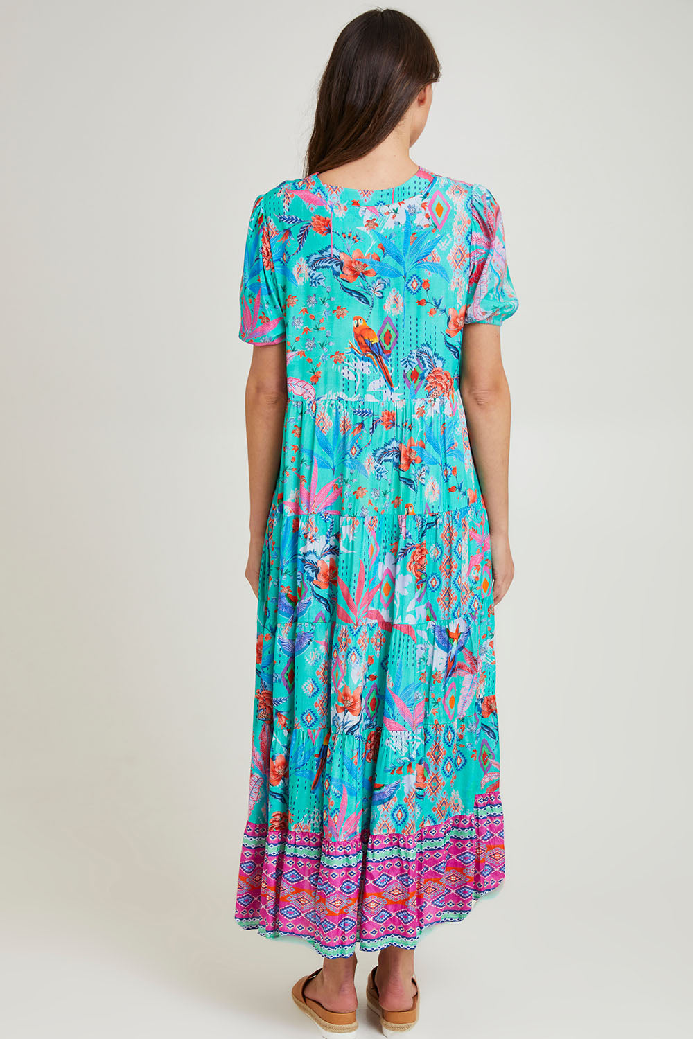 Model Madeline wearing size 10 of the Marina Maxi Dress in colour Print (Blue), from the back