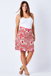 Model Laura wearing size M of the Mikko Aline Skirt in colour LipChino (Red), from the front, showing the whole outfit