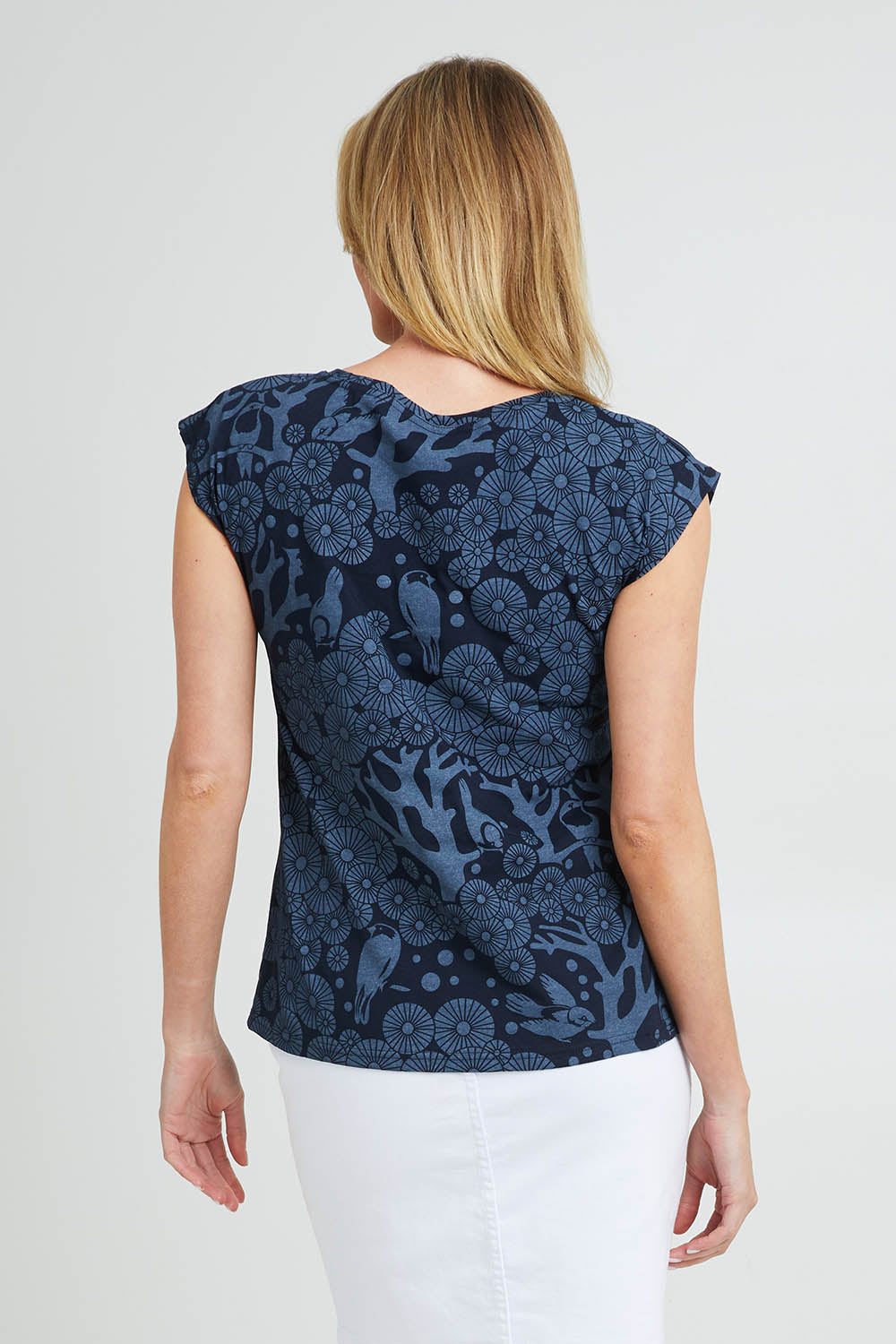Model Grace wearing size S of the Bobby Top in colour Navy (Blue), from the back