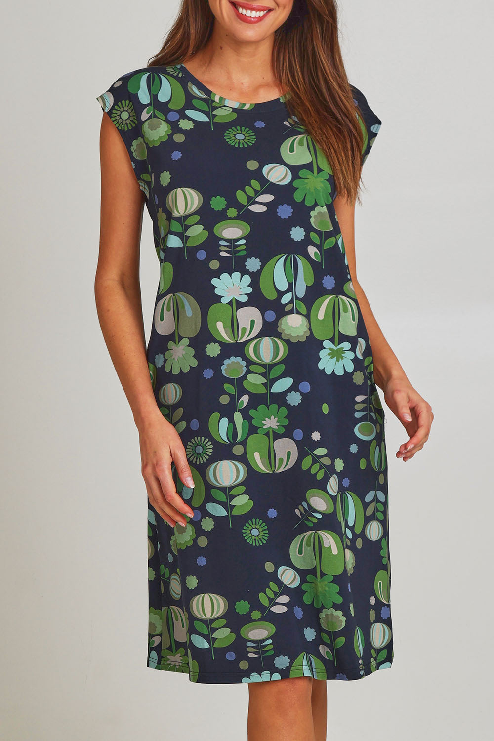 Model Madeline wearing size S of the Bobby Cotton Jersey Dress in colour Arugreen (Black), from the front, cropped image