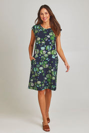 Model Madeline wearing size S of the Bobby Cotton Jersey Dress in colour Arugreen (Black), from the front, showing the whole outfit