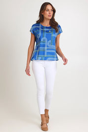 Model Madeline wearing size S of the Tilly Cotton Top in colour Blue (Blue), from the front, showing the whole outfit