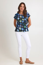 Model Madeline wearing size S of the Tilly Cotton Top in colour Black (Black), from the front, showing the whole outfit