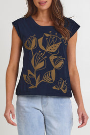 Model Madeline wearing the Bobby Cotton Top in colour Navylark (Blue), from the front, cropped image
