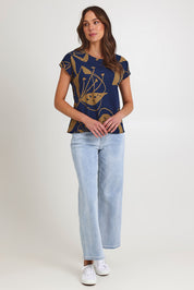 Model Madeline wearing size S of the Tilly Cotton Top in colour Navy (Blue), from the front, showing the whole outfit